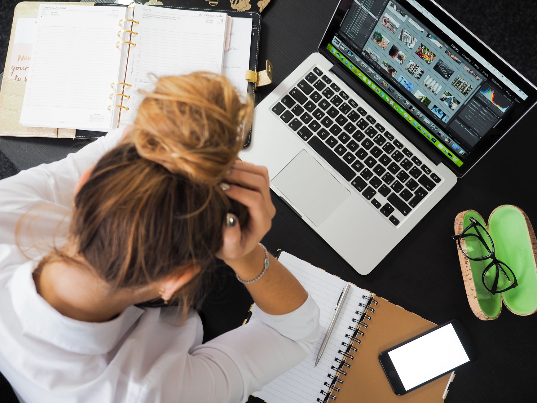 person looking at computer screen worry
